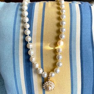 Simulated pearls with pavé diamond pendant